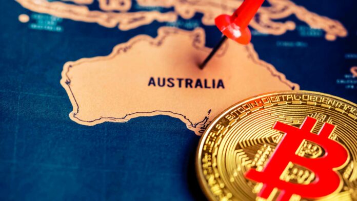 Mapa indicando el país de Australia junto a una moneda de Bitcoin.
